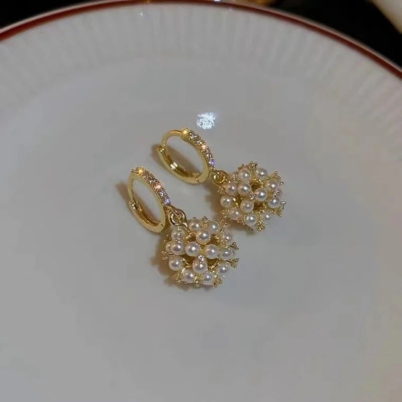 1 Pair of Golden-Tone Hoop Earrings with Shimmering Faux Freshwater Pearl Cluster